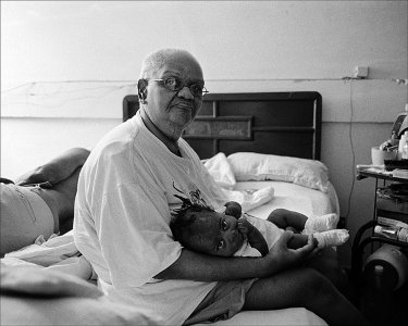 woman-w-baby-in-bed-husband-laying.jpg woman-w-baby-in-bed-husband-laying.jpg