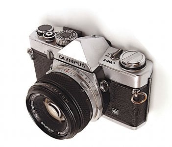 Olympus OM-1 MD had covered motor drive couoling on bottom, MD insignia on front.jpeg Olympus OM-1 MD had covered motor drive couoling on bottom, MD insignia on front.jpeg